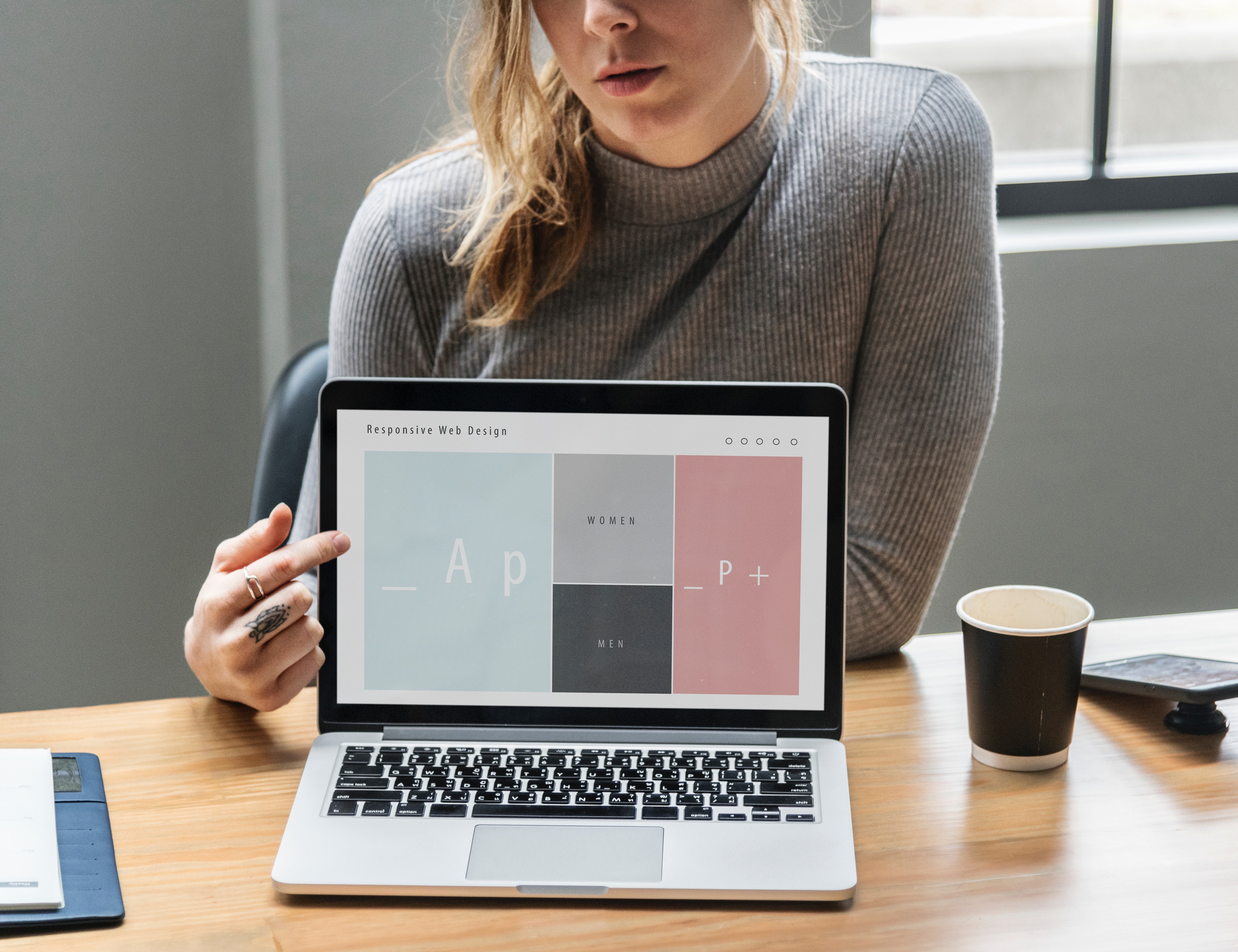 Girl demonstrating responsive design at computer
